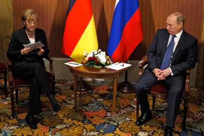 Путин обсудил с Меркель ситуацию на Украине за закрытыми дверями