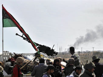 Силы Каддафи отбросили повстанцев на восток Ливии