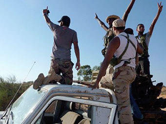 Ливийские войска вошли в родной город Каддафи